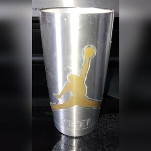 YETI Rambler tumbler with a customized, Decal Jordan, gold-colored graphic 